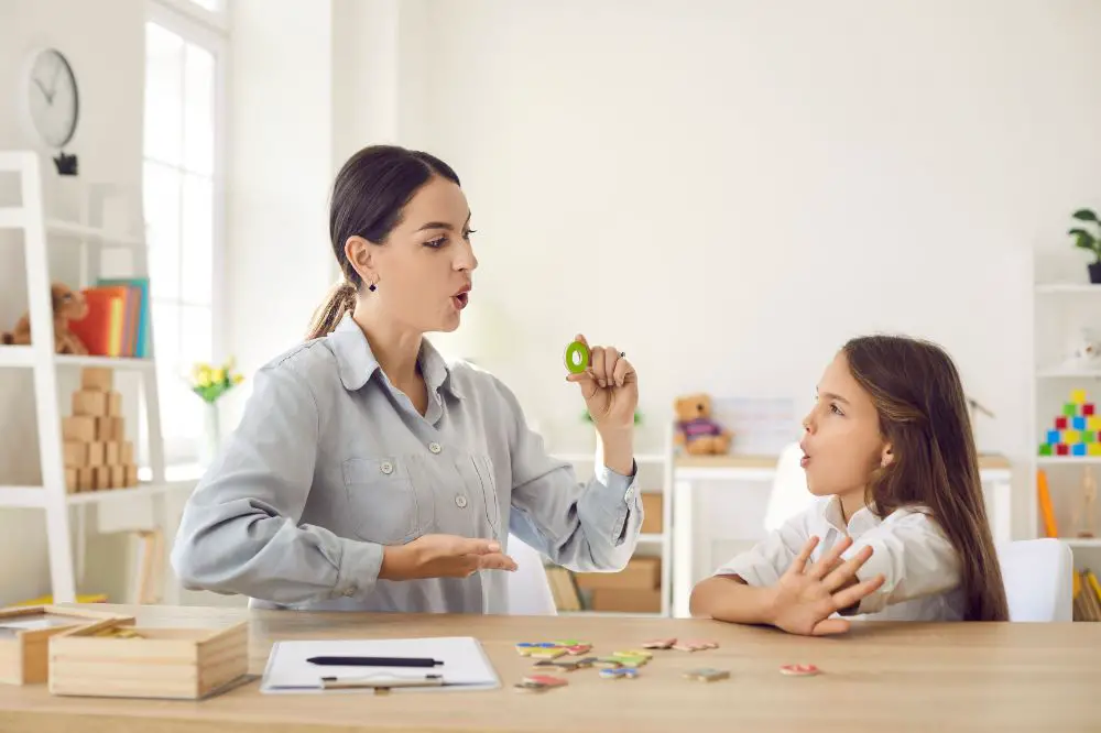 woman on a cycles approach speech therapy with a little child